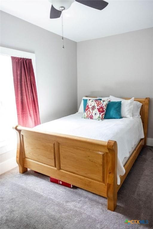 403 E 13th St, Shiner, TX 77984 - bedroom featuring carpet and ceiling fan