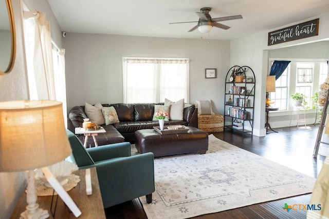 403 E 13th St, Shiner, TX 77984 - living area with healthy amount of natural light, ceiling fan, and wood finished floors