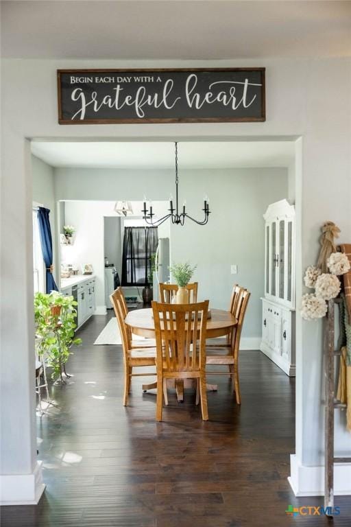 403 E 13th St, Shiner, TX 77984 - dining space featuring a chandelier and dark wood-style flooring