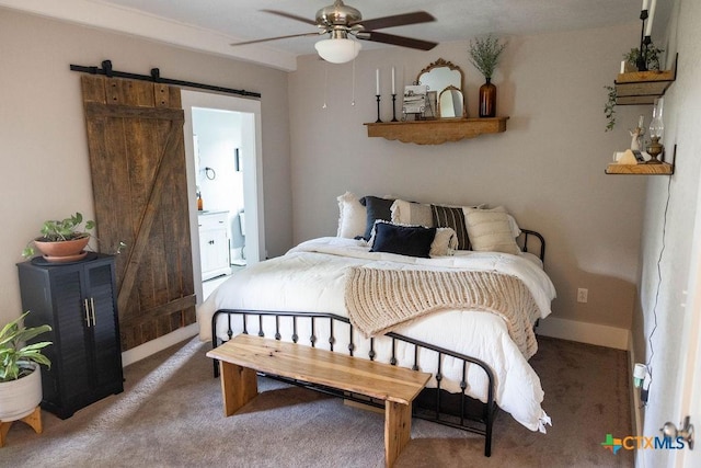 403 E 13th St, Shiner, TX 77984 - bedroom with a barn door and carpet floors