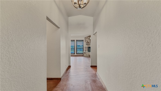 corridor with lofted ceiling