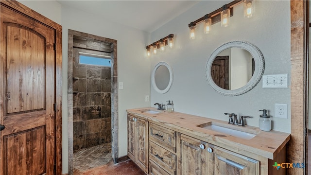 bathroom featuring vanity and a tile shower