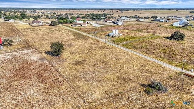 birds eye view of property featuring a rural view