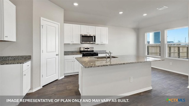 816 Indian Way, Seguin, TX 78155 - kitchen with appliances with stainless steel finishes, a sink, dark wood finished floors, light stone countertops, and white cabinetry