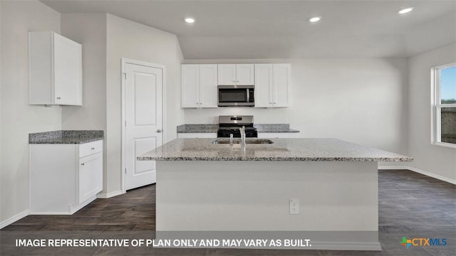 816 Indian Way, Seguin, TX 78155 - kitchen featuring appliances with stainless steel finishes, baseboards, light stone counters, dark wood-type flooring, and white cabinetry