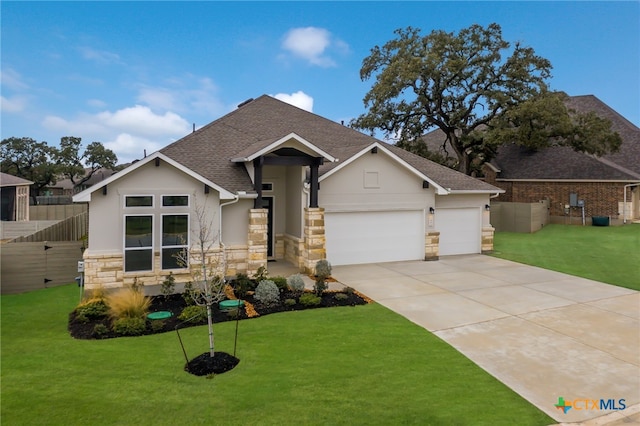 view of front of home featuring a garage and a front lawn