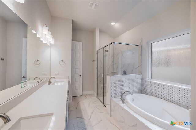 bathroom with vanity and separate shower and tub