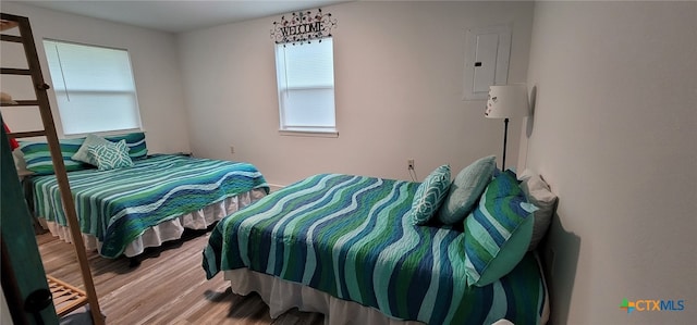 502 S 9th St, Seadrift, TX 77983 - bedroom with multiple windows, wood finished floors, and electric panel