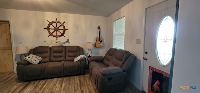 502 S 9th St, Seadrift, TX 77983 - living room with wood finished floors and a fireplace