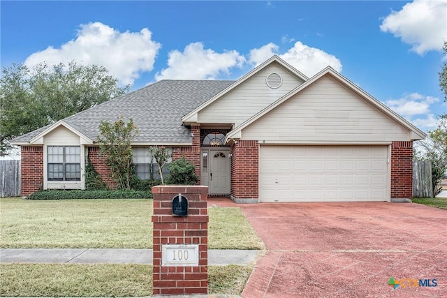 ranch-style home featuring a garage and a front yard