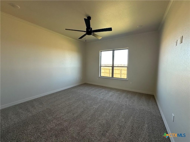 spare room featuring ornamental molding, ceiling fan, and carpet flooring