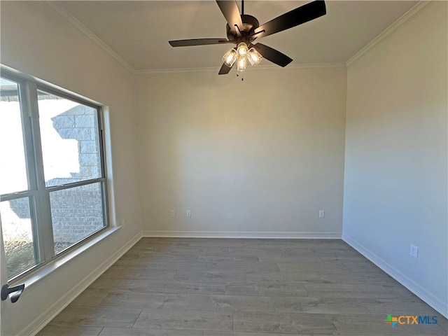 spare room featuring ornamental molding, ceiling fan, and light hardwood / wood-style floors