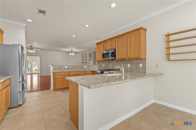 kitchen with ornamental molding, kitchen peninsula, stainless steel appliances, and light stone countertops