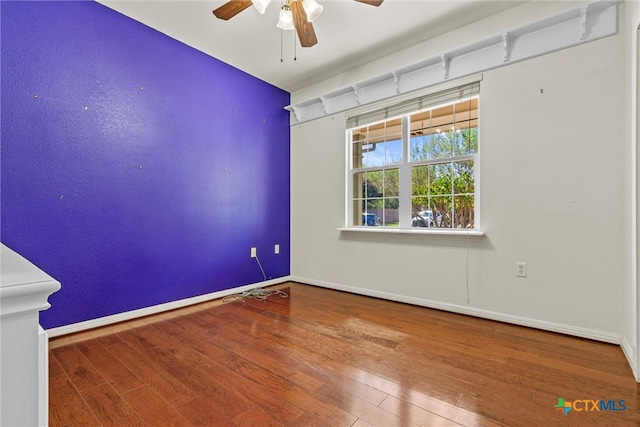 unfurnished room with wood-type flooring and ceiling fan