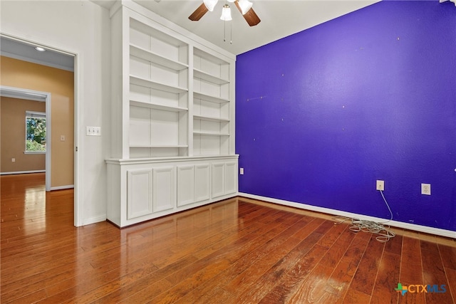 unfurnished room featuring wood-type flooring and ceiling fan