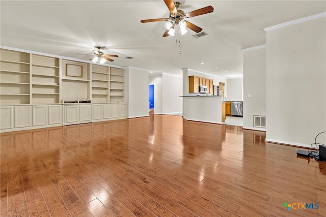 unfurnished living room with light hardwood / wood-style floors, ceiling fan, built in shelves, and ornamental molding