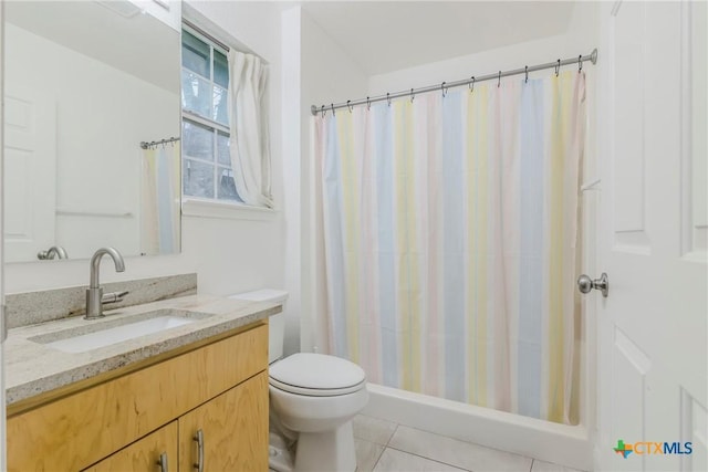 bathroom with tile patterned floors, toilet, and vanity