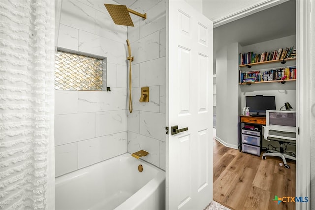 bathroom with wood finished floors and shower / bath combo