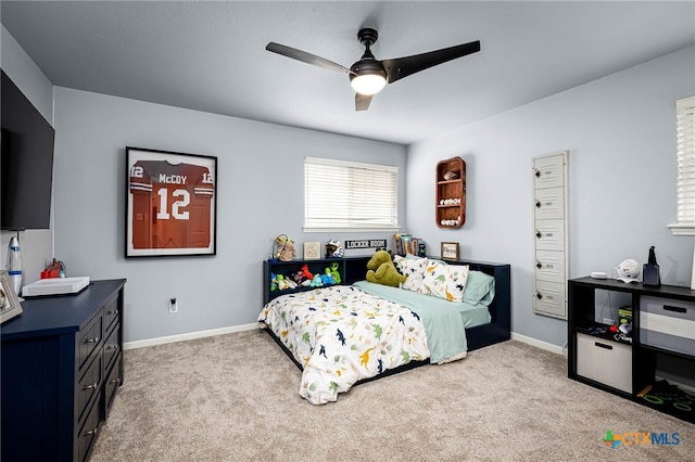 bedroom with carpet flooring, baseboards, and ceiling fan