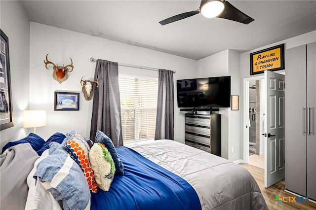 bedroom featuring a ceiling fan and wood finished floors