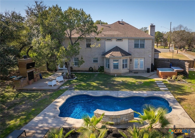 outdoor pool featuring a patio, fence, a hot tub, french doors, and a lawn