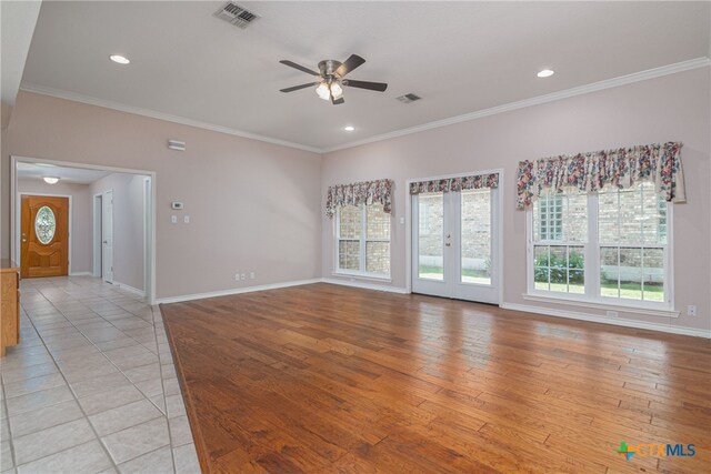 unfurnished room with ceiling fan, light hardwood / wood-style floors, and crown molding