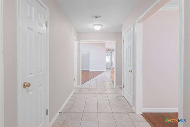 corridor with light wood-type flooring