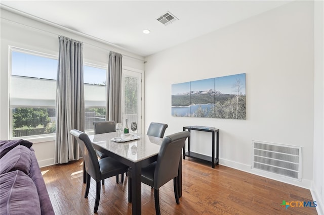 5401 Joe Sayers Ave Unit B, Austin, TX 78756 - dining area with wood-type flooring, visible vents, and baseboards