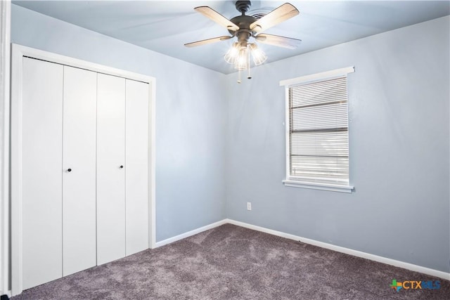 unfurnished bedroom with carpet flooring, ceiling fan, and a closet