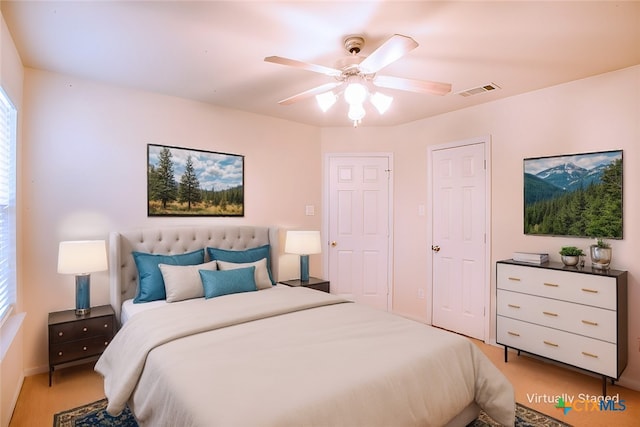 bedroom featuring visible vents and a ceiling fan