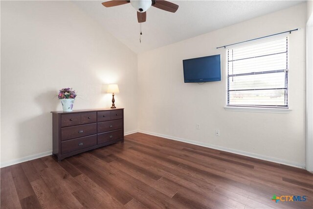 502 Geri Dr, Copperas Cove, TX 76522 - bedroom featuring dark wood finished floors, vaulted ceiling, and ceiling fan