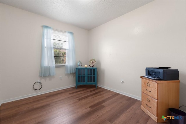 502 Geri Dr, Copperas Cove, TX 76522 - unfurnished bedroom with wood finished floors and a textured ceiling