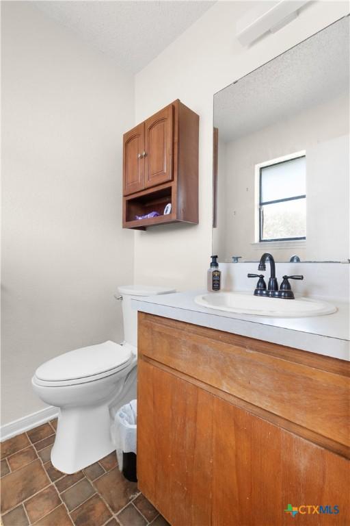 502 Geri Dr, Copperas Cove, TX 76522 - half bathroom featuring vanity and toilet