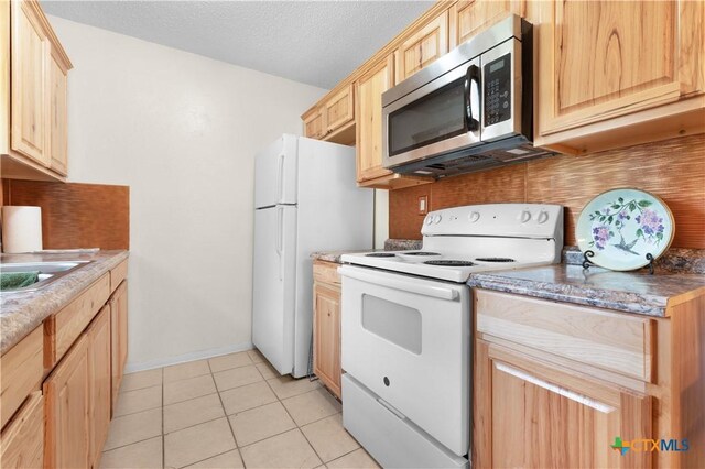 502 Geri Dr, Copperas Cove, TX 76522 - kitchen featuring white appliances, light brown cabinets, tasteful backsplash, light tile patterned flooring, and a textured ceiling