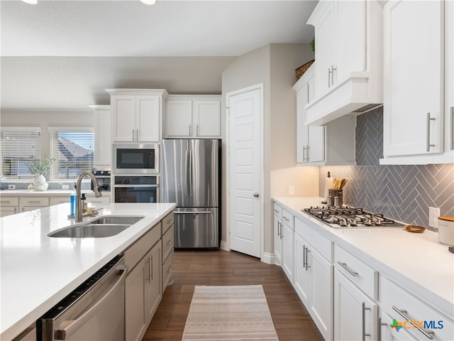 514 Orchard Way, New Braunfels, TX 78132 - kitchen with appliances with stainless steel finishes, a sink, light countertops, white cabinets, and vaulted ceiling