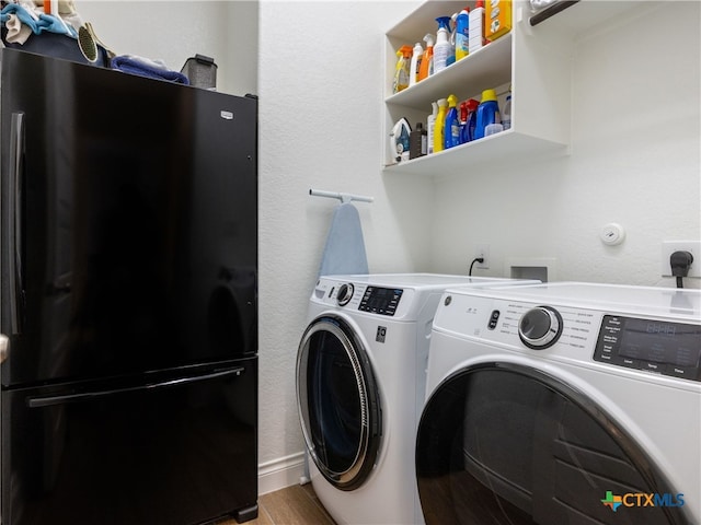 514 Orchard Way, New Braunfels, TX 78132 - clothes washing area with washer and clothes dryer and wood finished floors