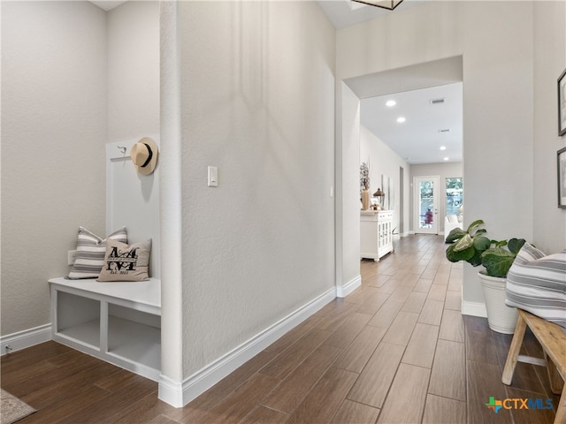 corridor featuring wood-type flooring and french doors