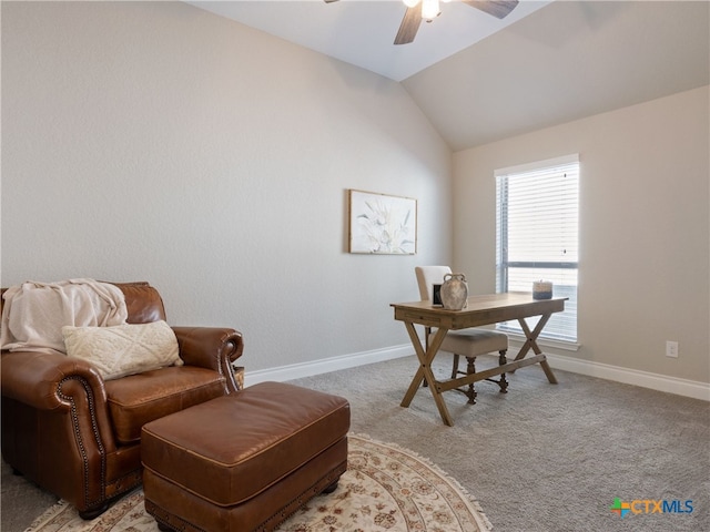 office space featuring ceiling fan, light colored carpet, and lofted ceiling