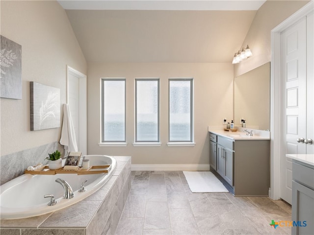 514 Orchard Way, New Braunfels, TX 78132 - bathroom featuring lofted ceiling, vanity, and a garden tub