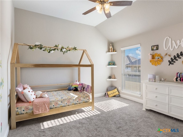 bedroom with ceiling fan, carpet floors, and vaulted ceiling