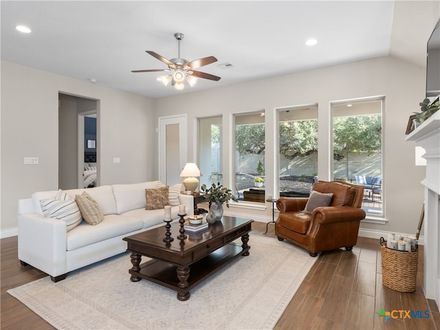514 Orchard Way, New Braunfels, TX 78132 - living area with wood finished floors, ceiling fan, a fireplace, baseboards, and recessed lighting