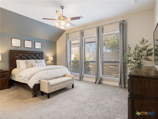 carpeted bedroom featuring vaulted ceiling and ceiling fan