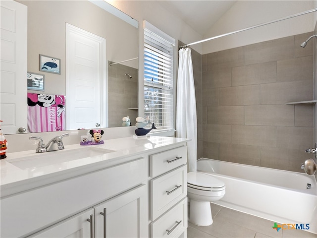 full bathroom with tile patterned floors, lofted ceiling, toilet, shower / tub combo with curtain, and vanity