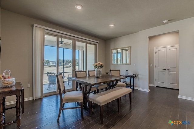 dining space featuring recessed lighting, dark wood-style flooring, and baseboards