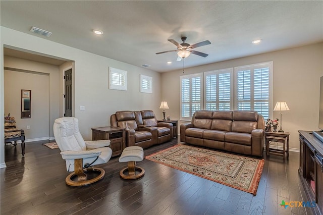 living room featuring baseboards, visible vents, a ceiling fan, dark wood-type flooring, and recessed lighting