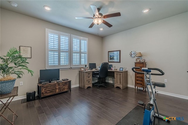 office area with ceiling fan, baseboards, and dark wood finished floors