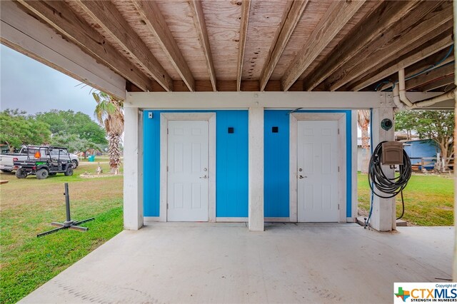 entrance to property with a yard