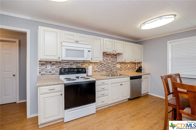 kitchen featuring white cabinetry, light hardwood / wood-style flooring, sink, and white appliances