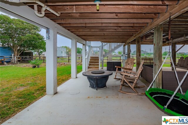 view of patio with an outdoor fire pit