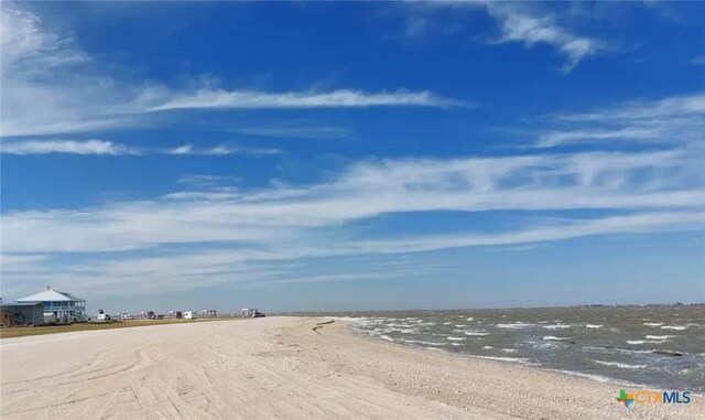 view of road with a beach view and a water view